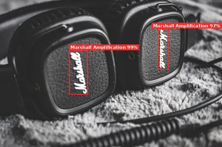 A pair of headphones with both Marshall logos outlined in red and labeled Marshall Amplification with confidence scores by the logo detection API